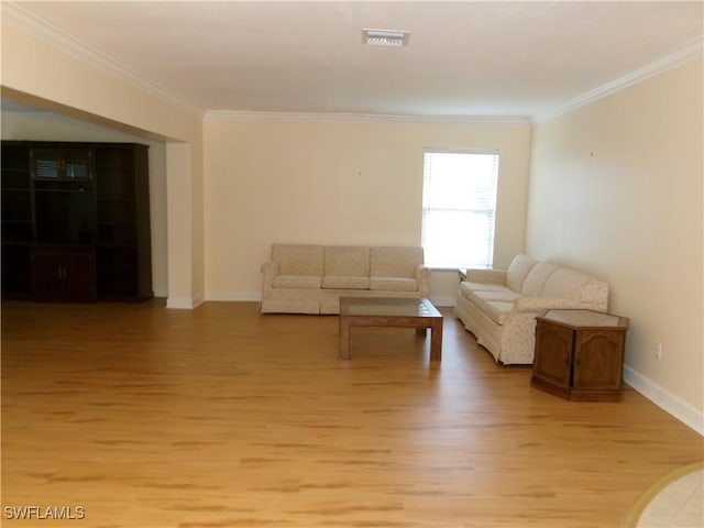 5447 Capbern Ct, Fort Myers, FL 33919 - unfurnished living room with light wood finished floors, baseboards, visible vents, and ornamental molding