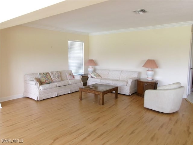 5447 Capbern Ct, Fort Myers, FL 33919 - living room featuring visible vents, baseboards, light wood-style flooring, and crown molding