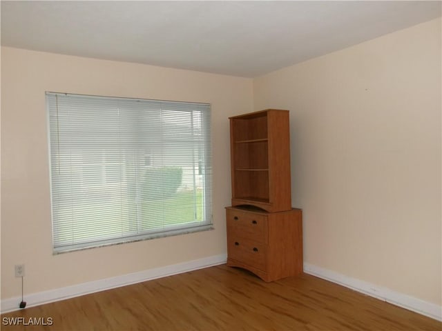 5447 Capbern Ct, Fort Myers, FL 33919 - empty room with baseboards and wood finished floors