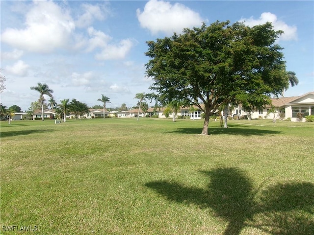 5447 Capbern Ct, Fort Myers, FL 33919 - view of property's community featuring a yard and a residential view