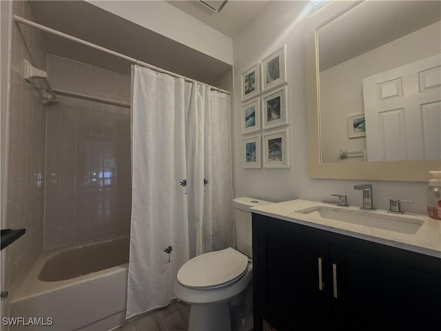 bathroom with toilet, shower / bathtub combination with curtain, and vanity