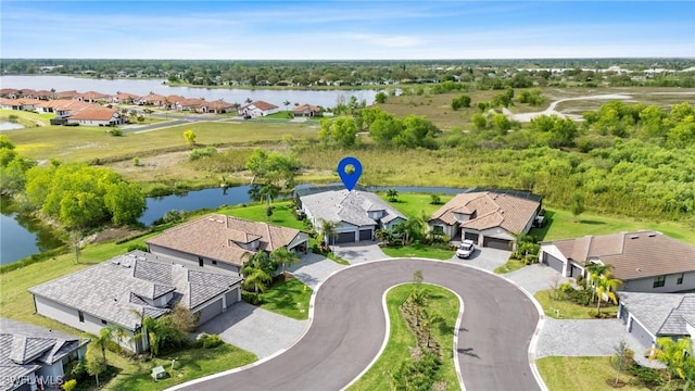 birds eye view of property featuring a residential view and a water view