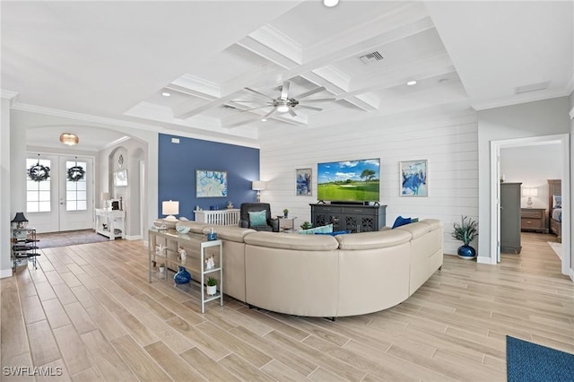 living area featuring arched walkways, visible vents, wood tiled floor, coffered ceiling, and beamed ceiling