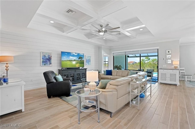 living area with beam ceiling, visible vents, and wood tiled floor