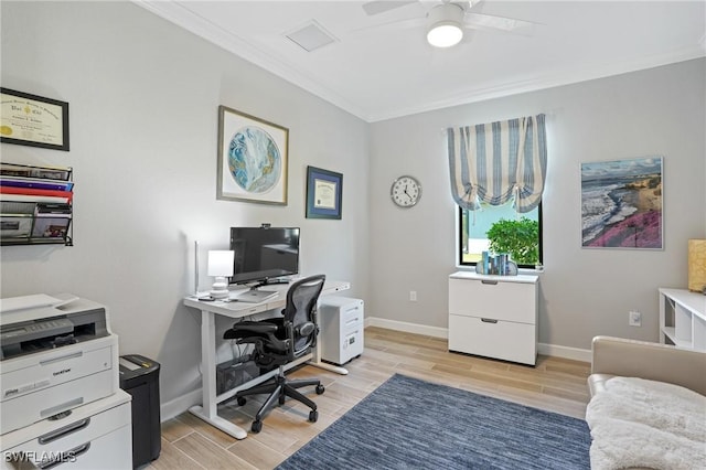 office featuring wood finish floors, crown molding, and baseboards