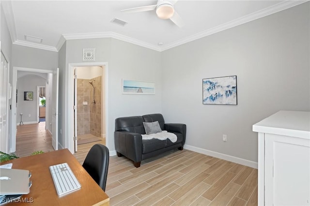 office area featuring baseboards, ornamental molding, visible vents, and light wood-style floors