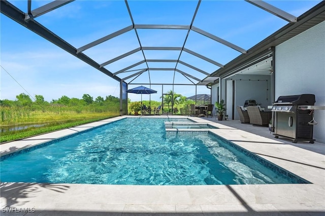 view of swimming pool with a patio area, glass enclosure, area for grilling, and a pool with connected hot tub