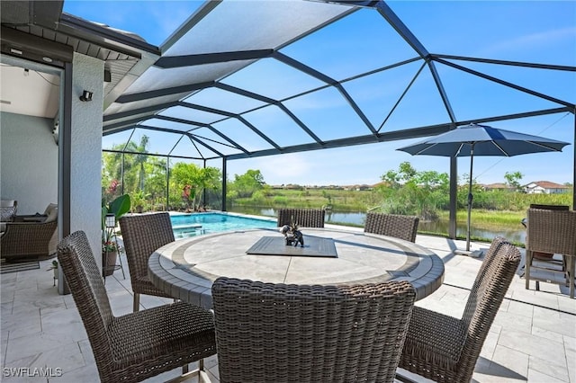 view of patio with outdoor dining space, a lanai, a water view, and an outdoor pool