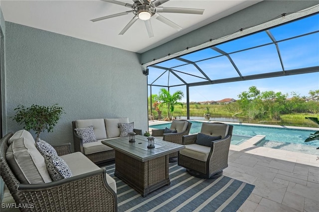 view of patio featuring a ceiling fan, a lanai, outdoor lounge area, and a pool with connected hot tub