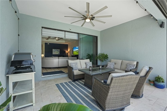 view of patio / terrace featuring a ceiling fan and an outdoor hangout area