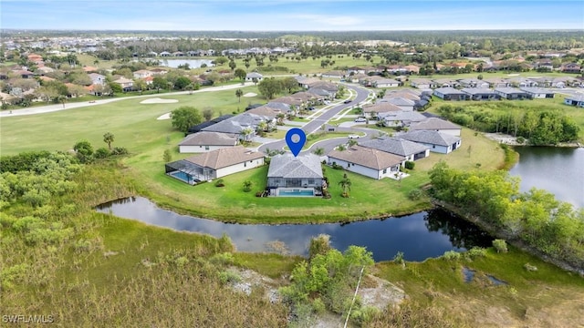 bird's eye view featuring a water view and a residential view