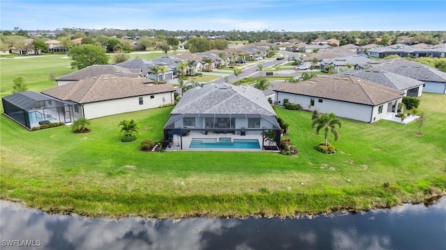 bird's eye view featuring a residential view and a water view