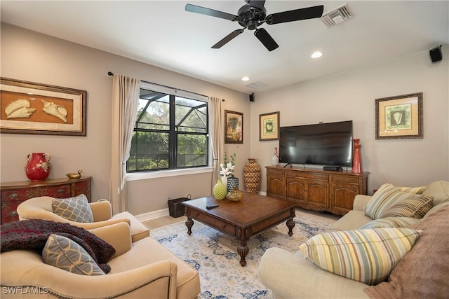 living room featuring baseboards, visible vents, a ceiling fan, light wood-style floors, and recessed lighting