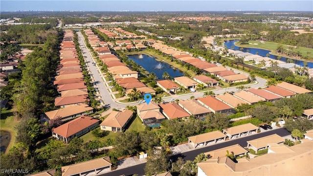 bird's eye view featuring a residential view and a water view