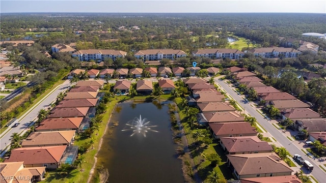 birds eye view of property with a residential view and a water view