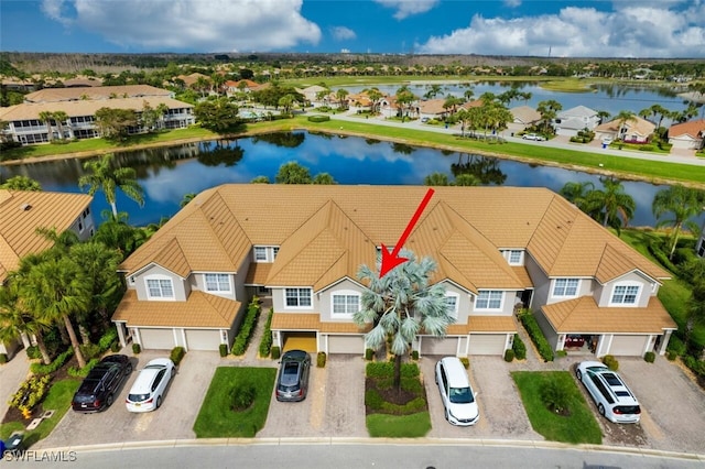 bird's eye view with a water view and a residential view