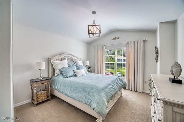 bedroom with vaulted ceiling, baseboards, a notable chandelier, and light colored carpet