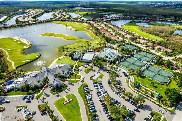 aerial view with view of golf course and a water view