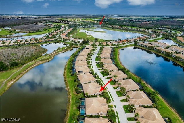 bird's eye view featuring a residential view and a water view