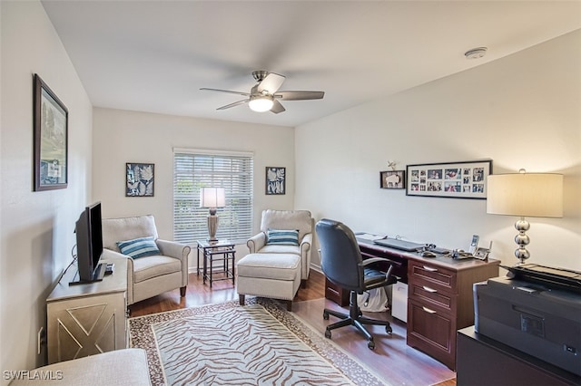 office space featuring a ceiling fan and light wood finished floors