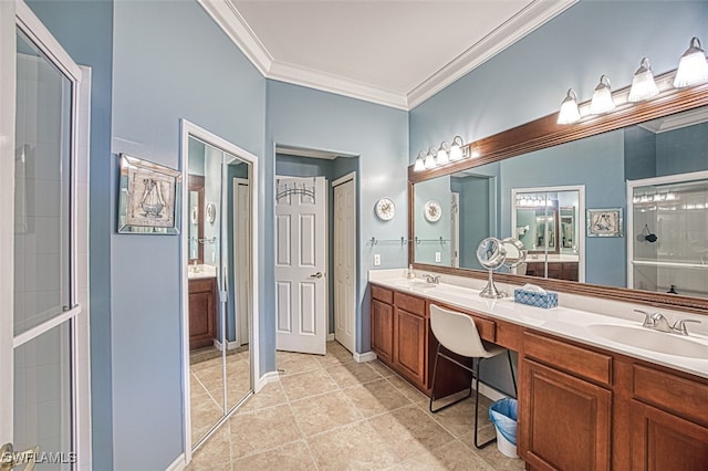 full bath with crown molding, double vanity, tiled shower, and a sink