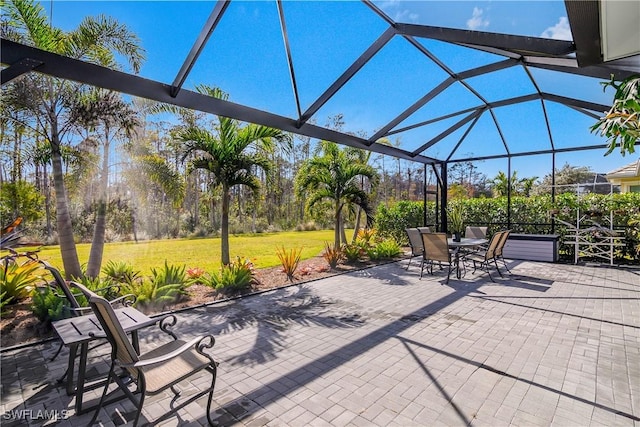 view of patio with glass enclosure