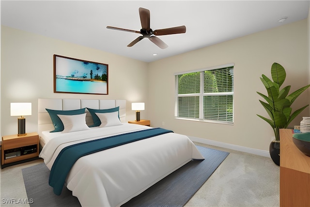 carpeted bedroom featuring ceiling fan