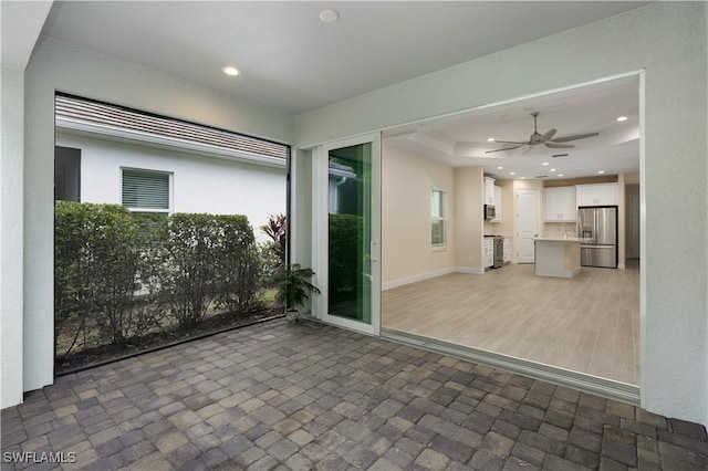 view of patio / terrace featuring an outdoor kitchen and ceiling fan