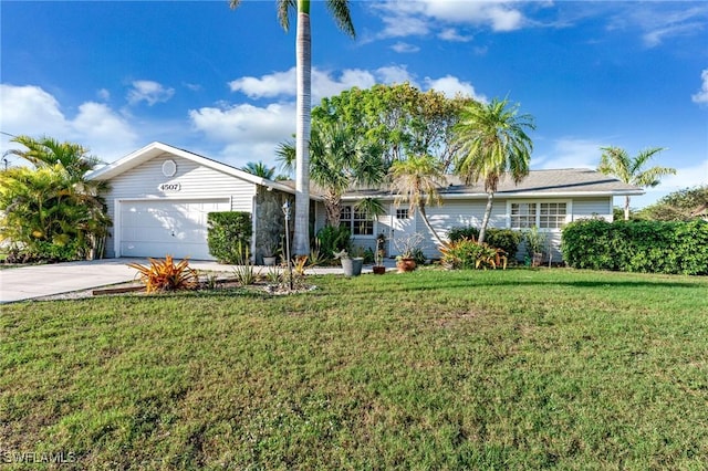 ranch-style house with a garage, concrete driveway, and a front lawn