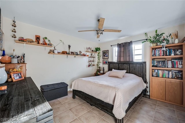 bedroom featuring a ceiling fan and light tile patterned floors