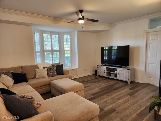 living room featuring ornamental molding, ceiling fan, dark wood-style flooring, and baseboards
