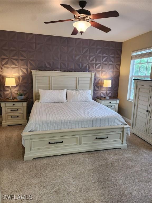 bedroom featuring wallpapered walls, carpet, and ceiling fan