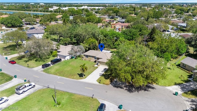 bird's eye view with a residential view and a water view