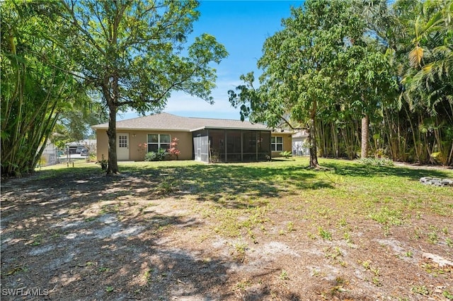 view of yard with a sunroom