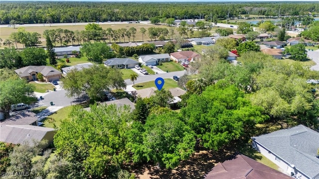 aerial view with a residential view and a wooded view