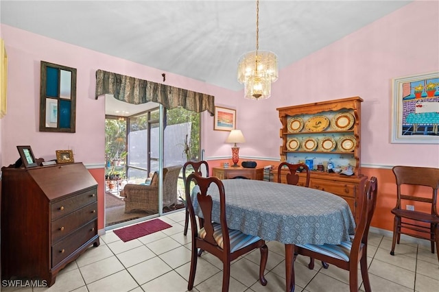 dining room with a chandelier and light tile patterned flooring