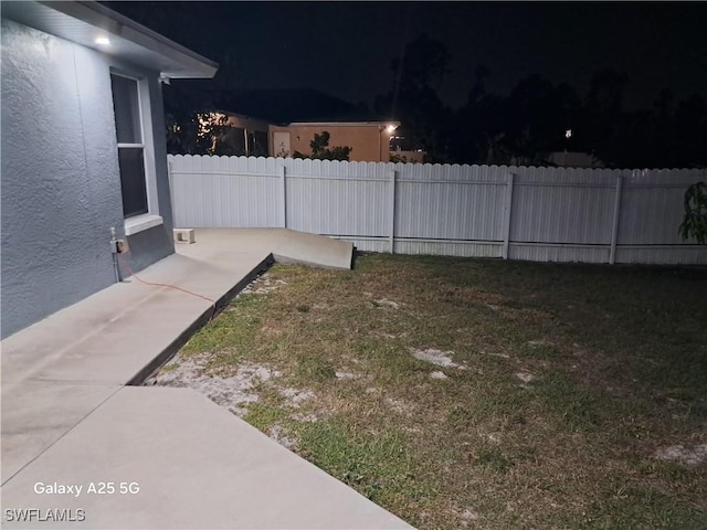 yard at night with fence