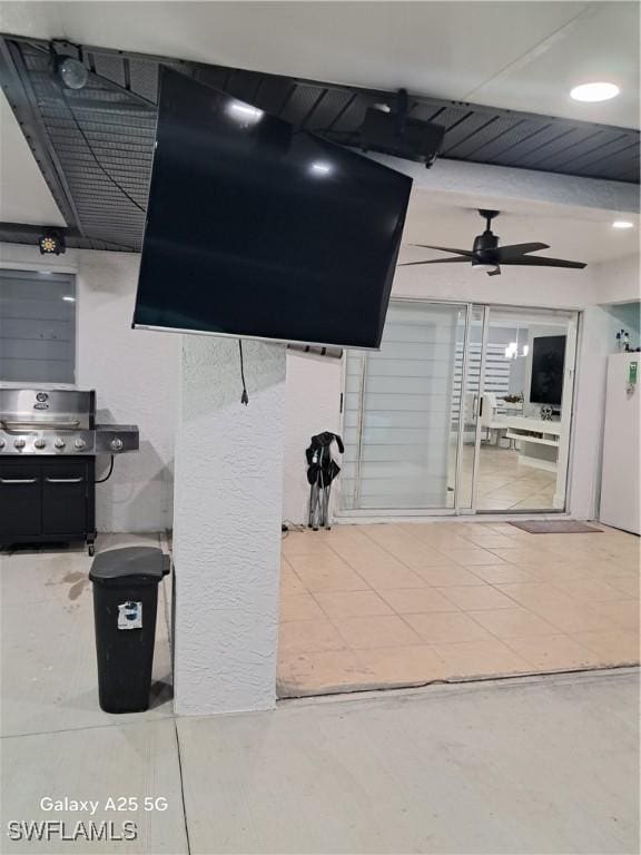 interior space with ceiling fan