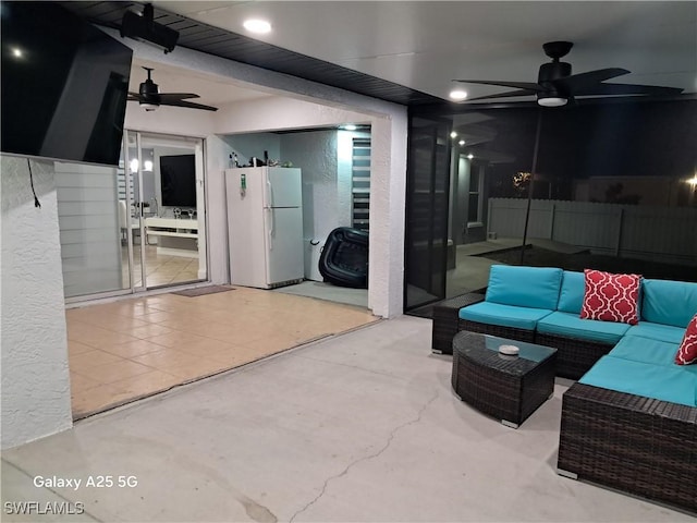 view of patio featuring an outdoor living space and ceiling fan