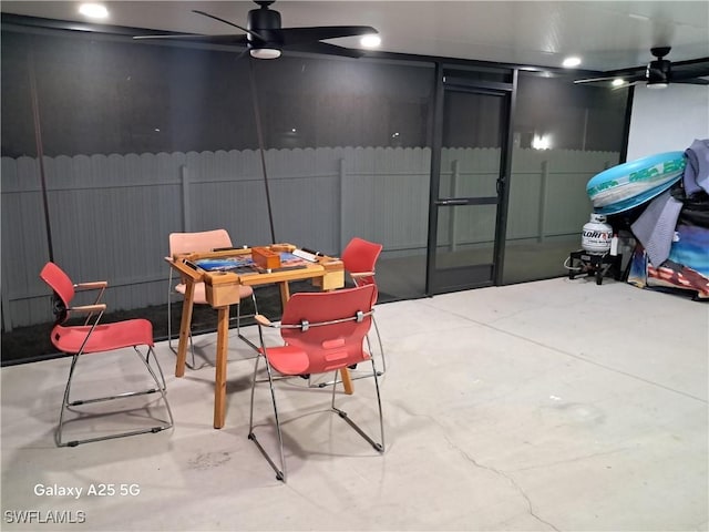 view of patio with outdoor dining area, ceiling fan, and fence