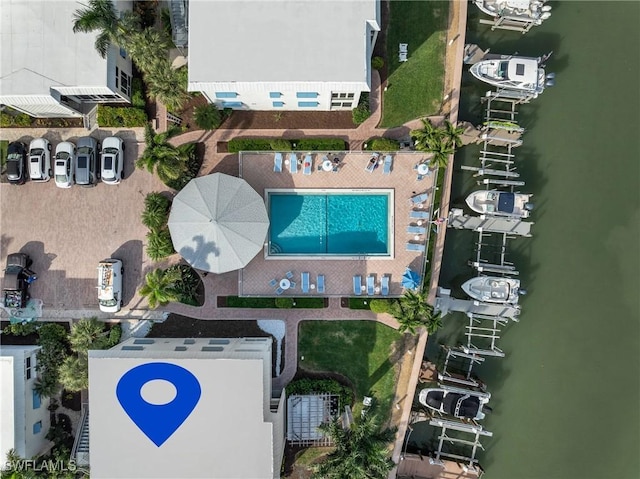 birds eye view of property featuring a water view