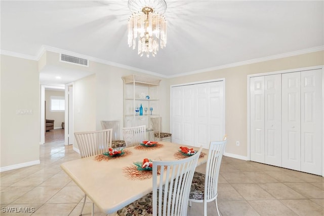 dining space with a chandelier, light tile patterned flooring, visible vents, baseboards, and ornamental molding