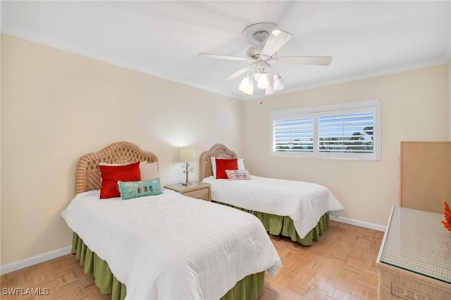 bedroom featuring baseboards, a ceiling fan, and ornamental molding