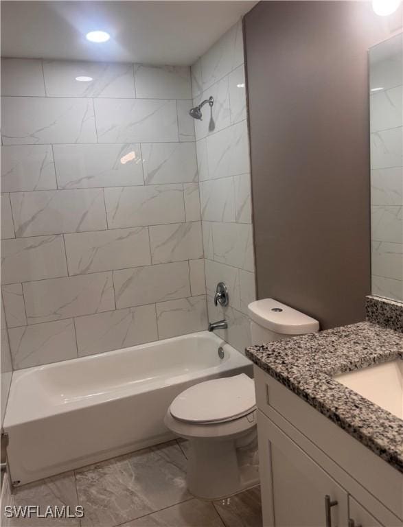 full bath featuring toilet, marble finish floor, vanity, and shower / bathing tub combination