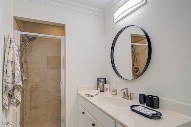 full bath with ornamental molding, a shower stall, and vanity