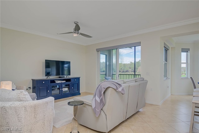 living area with ceiling fan, ornamental molding, light tile patterned flooring, and baseboards