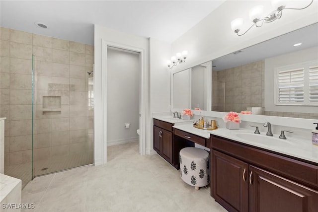 bathroom featuring vanity, a walk in shower, and toilet