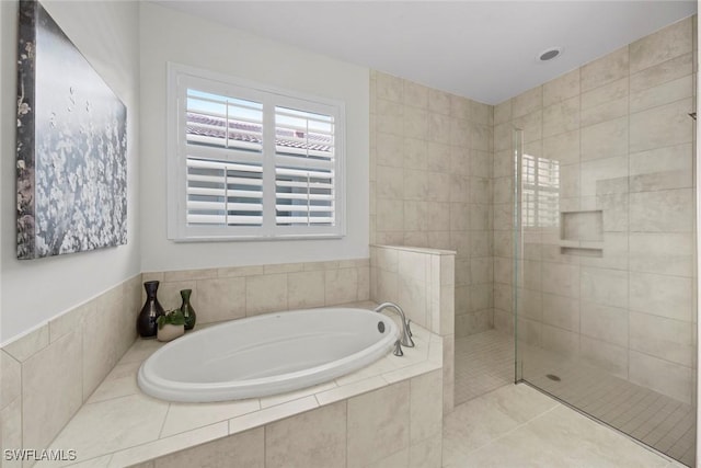 full bathroom with a bath, tile patterned flooring, and a walk in shower
