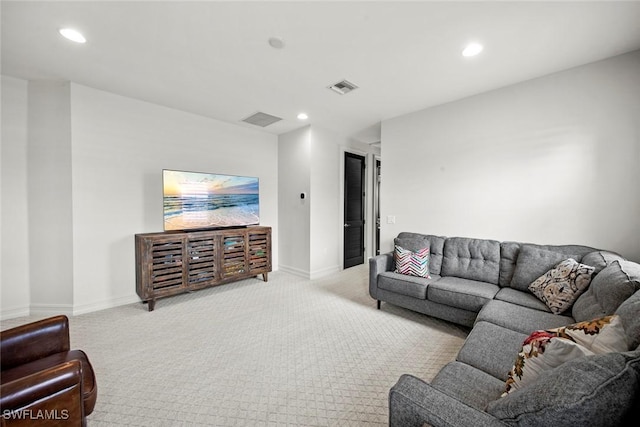 living room with light carpet, visible vents, and recessed lighting