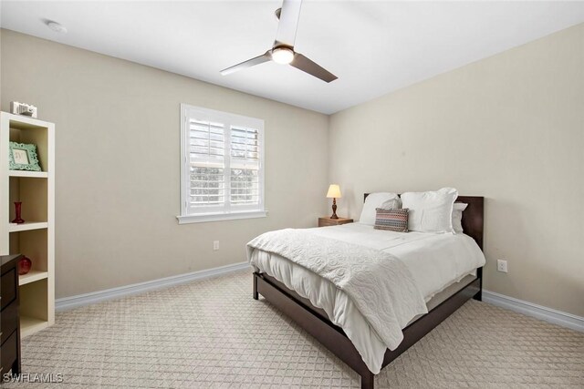 bedroom featuring carpet flooring, baseboards, and a ceiling fan